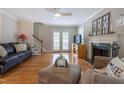 Bright living room features hardwood floors, a fireplace, and neutral décor at 1809 Green Ford Ln, Apex, NC 27502