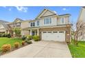 Beautiful two-story home with vinyl siding, brick accents, well-kept lawn and a two-car garage at 1919 Sinclair Trce, Burlington, NC 27215