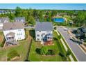 Aerial view of a two-story home with a fenced yard, deck, and proximity to community amenities at 240 Liberty Star Rd, Wendell, NC 27591