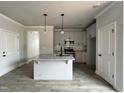 Bright kitchen with a center island, stainless steel appliances and a modern design at 250 Bluejay St, Clayton, NC 27520
