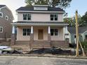 Charming two-story home with a welcoming front porch and brick accents at 2654 Lawndale, Durham, NC 27705