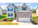 Attractive home featuring varied siding and a two-car garage at 3338 Prospect Parkway Pkwy, Durham, NC 27703