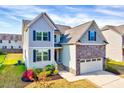 Beautiful two-story home boasting well-maintained lawn, and complementary two-car garage at 3338 Prospect Parkway Pkwy, Durham, NC 27703