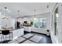 Bright kitchen with white cabinets, granite counters, stainless appliances, and eat-in island at 3338 Prospect Parkway Pkwy, Durham, NC 27703