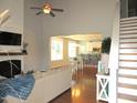 Bright living room featuring hardwood floors and a shiplap fireplace at 3530 Winding Walk Ct, Raleigh, NC 27616
