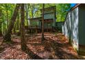 Back of the house featuring a lovely deck, offering a relaxing outdoor space at 3719 W Cornwallis Rd, Durham, NC 27705