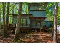 Back of the house featuring a lovely deck, offering a relaxing outdoor space at 3719 W Cornwallis Rd, Durham, NC 27705