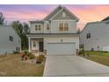 Charming two-story home with a two-car garage, well-maintained lawn, and inviting curb appeal at 4005 Sierra Pelona Dr, Raleigh, NC 27616