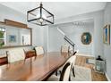 Spacious dining room featuring a large dining table, modern lighting fixture, and elegant decor accents at 416 Glenview Ln, Durham, NC 27703