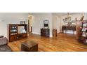 Spacious living room featuring beautiful hardwood floors and ample space for furnishings and decor at 431 Waddill St, Henderson, NC 27536
