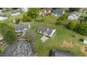 Aerial view of a well-manicured house with a spacious backyard in a quiet neighborhood at 5505 Armada Dr, Raleigh, NC 27610