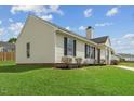A charming home showcasing neat landscaping and durable vinyl siding at 5505 Armada Dr, Raleigh, NC 27610