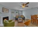 Bright living room offers a fireplace and comfortable seating arrangement with natural light at 5900 Shady Grove Cir, Raleigh, NC 27609