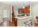 Beautiful kitchen with granite countertops, stainless steel appliances, and a breakfast bar at 7328 Caversham Way, Raleigh, NC 27617