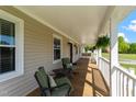 Relaxing front porch with comfortable seating and scenic views of the surrounding landscape at 8700 Crowder Rd, Raleigh, NC 27603