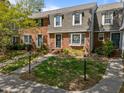Charming brick townhouse with a well-maintained front yard and inviting curb appeal at 1020 Randolph Ct, Cary, NC 27511