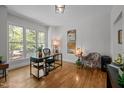 Bright office space features hardwood floors, large windows with natural light, and neutral walls for a productive workspace at 107 Deer St, Carrboro, NC 27510