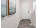 Welcoming entryway features wood-look floors, a white front door, and neutral paint at 112 Red Maple St, Sanford, NC 27332