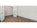 Flex room with dark wood-look flooring, bright light and a glass paneled door at 138 Fair Child Rd, Spring Lake, NC 28390