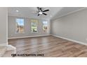 Spacious living room with luxury vinyl flooring and three windows at 141 Pearl St # 9, Garner, NC 27529