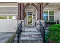 Close-up of the entryway with a stone staircase and wood accents at 2008 Stanwood Dr, Apex, NC 27502
