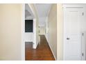 Bright hallway with hardwood floors and white trim leading into other rooms at 226 Fair Oaks Ct, Mebane, NC 27302