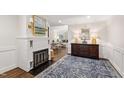 Elegant living room featuring a fireplace, hardwood floors, and sophisticated decor, perfect for entertaining at 2415 Van Dyke Ave, Raleigh, NC 27607