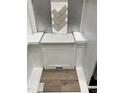 Selection of herringbone backsplash tiles, a quartz countertop, stylish cabinet and luxury vinyl flooring at 311 Chesapeake Commons St # 101, Garner, NC 27529