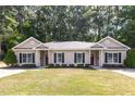 Exterior view of the paired single-Gathering homes featuring a well-maintained lawn and inviting curb appeal at 411 A Aversboro Rd, Garner, NC 27529