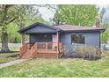 Inviting single-story home featuring a cozy front porch and neatly landscaped yard at 4513 Denfield St, Durham, NC 27704