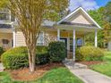 Attractive home with a covered front porch, neat landscaping, and natural light at 522 Auburn Square Dr, Durham, NC 27713