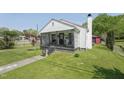 Exterior view of home featuring lawn and cozy front porch at 729 S Carolina Ave, Henderson, NC 27536