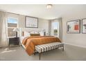 Cozy main bedroom featuring a king-size bed, neutral tones, and ample natural light at 900 Emmer St, Rolesville, NC 27571