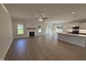 Spacious living area with fireplace, hard wood floors, and an open-concept design to the kitchen at 1008 Peedin Rd, Selma, NC 27576