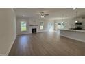 Spacious living room with fireplace, wood flooring, and open floor plan at 1008 Peedin Rd, Selma, NC 27576