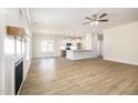 Bright open-concept space with fireplace and views into the light kitchen at 1008 Peedin Rd, Selma, NC 27576