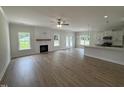 Spacious living room featuring a fireplace, wood-look flooring, and an open layout at 1008 Peedin Rd, Selma, NC 27576