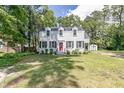Inviting two-story home with a well-maintained lawn and a detached shed at 1106 Sycamore St, Rocky Mount, NC 27801