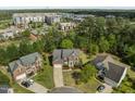 Aerial view showcases this brick home, with a well-manicured lawn, and close proximity to upscale shopping at 112 Natchez Ct, Cary, NC 27519