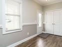 Bright foyer with wood floors, window, and closet for storage at 125 Claymore Dr, Clayton, NC 27527