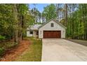 Beautiful exterior of the house, with a 2 car garage, concrete driveway, and a landscaped front yard at 1368 Ohio Ln, Sanford, NC 27332