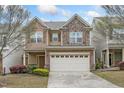 Charming two-story home with a two car garage, stone accents, and well maintained landscaping at 140 Torrey Heights Ln, Durham, NC 27703