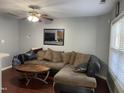 Cozy living room with plush seating, overhead fan, and a stylish coffee table, perfect for relaxation at 158 Randolph Dr, Clayton, NC 27520