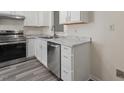 Bright kitchen features stainless steel appliances, modern cabinets, and stylish countertops, perfect for cooking and entertaining at 1808 Elkpark Dr, Raleigh, NC 27610