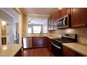 Well-equipped kitchen featuring stainless steel appliances and granite countertops at 2945 Casona Way, Raleigh, NC 27616