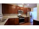 Modern kitchen boasts stainless steel appliances and ample cabinet space at 2945 Casona Way, Raleigh, NC 27616