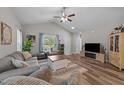 Spacious living room with vaulted ceilings, comfortable seating, and natural light at 318 Natchez Trace, Fuquay Varina, NC 27526