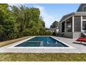 Beautiful backyard swimming pool featuring a spa and patio area, perfect for outdoor enjoyment at 3416 Edgemont Dr, Raleigh, NC 27612