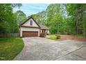 Charming one-story home with a well-manicured front lawn and a two-car garage at 3428 Hardwood Dr, Apex, NC 27539