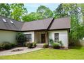 A lovely home with a welcoming front porch and beautiful green lawn at 3428 Hardwood Dr, Apex, NC 27539